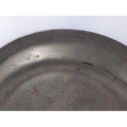 213 - A substantial early eighteenth century Scottish Communion Plate in pewter.  38cm in diameter,  Some ... 