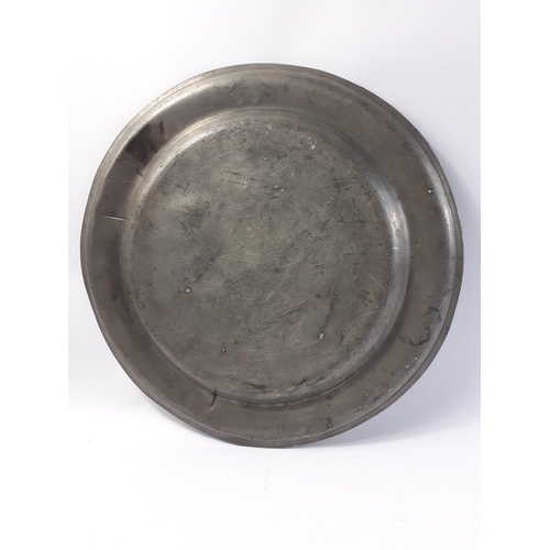 213 - A substantial early eighteenth century Scottish Communion Plate in pewter.  38cm in diameter,  Some ... 