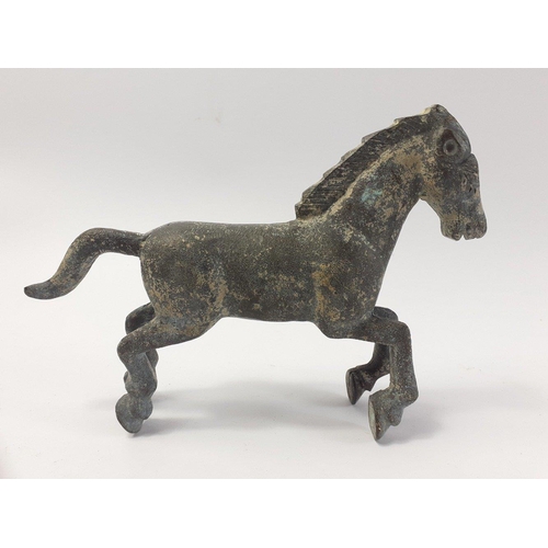 227 - A sprightly bonze horse (16cm long x 11cm high), this was reputedly dug up in a garden in the Selkir... 