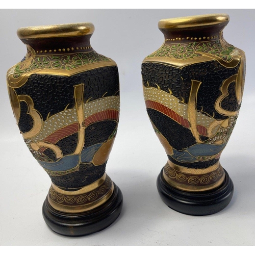 229 - A pair of old decorative JAPANESE SATSUMA VASES on dark wood stands - dimensions each vase 20cm tall... 