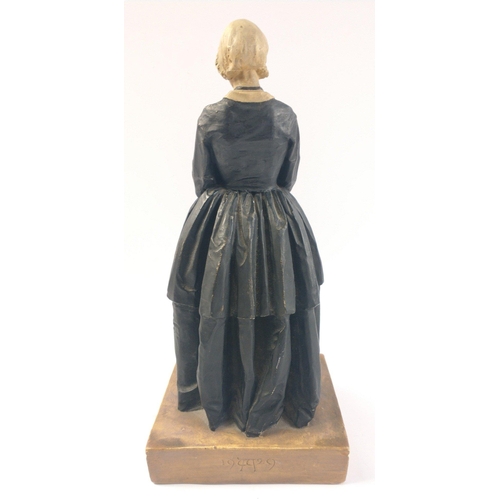 293 - A figure of FLORENCE NIGHTINGALE as portrayed by Dame Edith Evans, dated 1929, modelled in plaster w... 