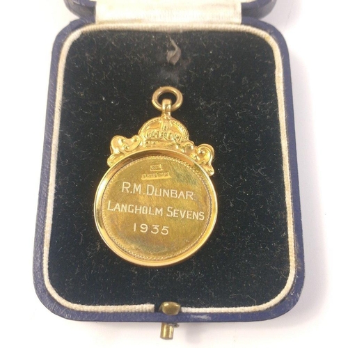 31 - A VINTAGE 1935 Langholm Sevens medal hallmarked 375 with a Birmingham hallmark, 4cm long, weight 6g#... 