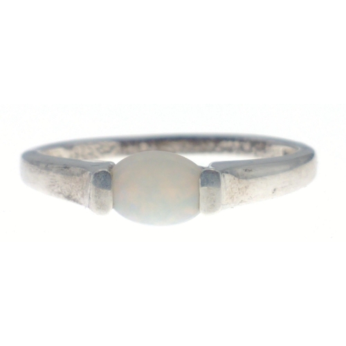 77 - A silver ring, stamped 925, with central oval stone (possibly opal), Size R, gross weight 1.5g#77... 