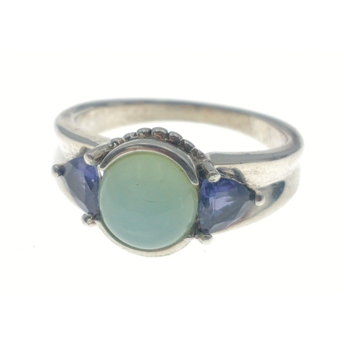 78 - A silver ring, stamped 925, with a central pale green stone and 2 blue stones, Size R, gross weight ... 