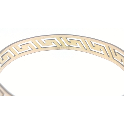 96 - Four fine costume bangles 7cm dia approx, one Greek key-style rolled gold bracelet 6.5cm dia approx,... 