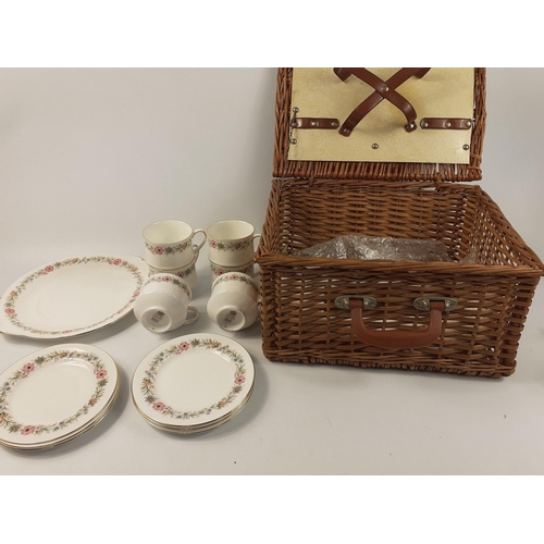 125 - A small vintage wicker picnic basket with a part-PARAGON teaservice#125