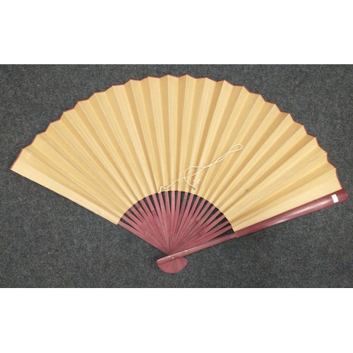 29 - An Oriental wooden folding fan with a design of chrysanthemums etc on paper length 70cm#29