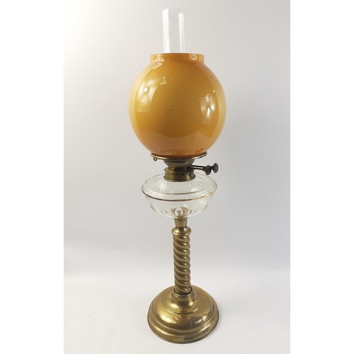 337 - A very attractive brass twist stem large oil lamp complete with tank, burner, funnel and shade. Some... 