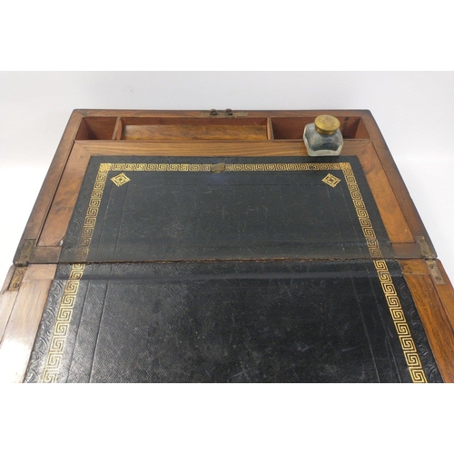 103 - A Victorian wooden writing slope externally  in nice aged condition.  There is a crack to the lid at... 