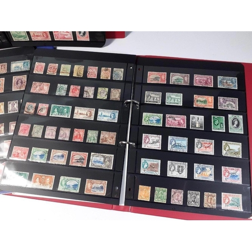 113 - STAMPS - three stamp albums with stock cards containing predominently BRITISH COLONIAL stamp issues.... 