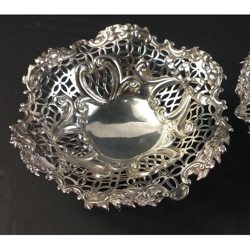 184 - Two silver bonbon dishes on four raised feet, hallmarked, London 1890, by William Comyns and Sons, 1... 