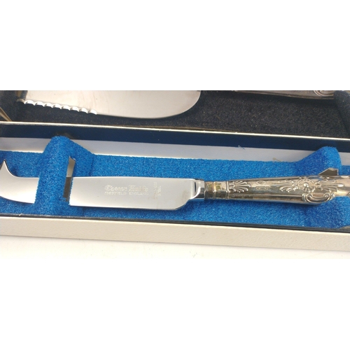 187 - A boxed cheese knife, gross weight 35g approx (20cm approx) with silver hallmarked handle, Sheffield... 