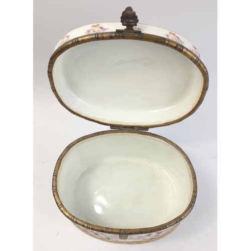 242 - A CAPODIMONTE large oval shaped porcelain box with hinged top and raised pattern with classical scen... 