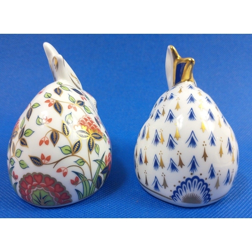 249 - Two ROYAL CROWN DERBY rabbit paperweights both with gold stopper, one in blue and white with gilt ac... 