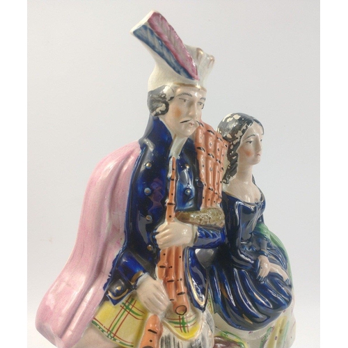 271 - A flat-back Staffordshire handpainted Victorian Scottish couple fireplace figurine - dimensions 36cm... 