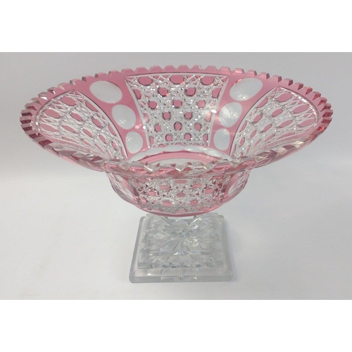 409 - A Bohemian style cranberry cut-glass rose bowl on a clear glass pedestal standing 20cm high, diamete... 