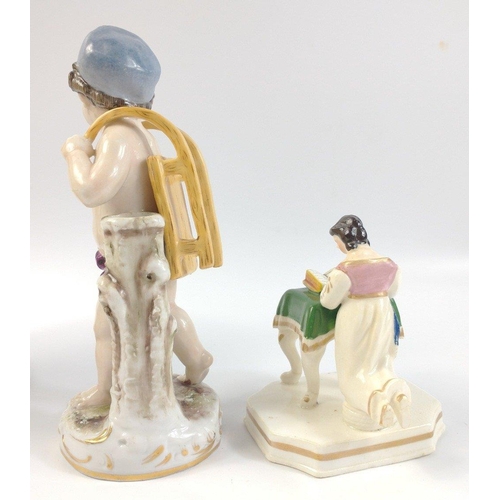 417 - A small collection of decorative ceramic and glass items to include a young boy with a sledge on his... 