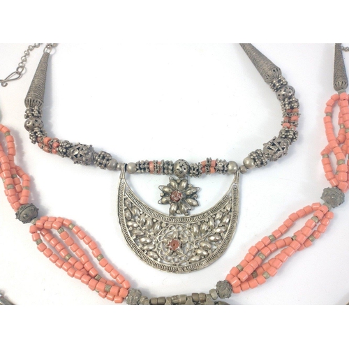 42 - Three lovely vintage Middle Eastern necklaces with coral coloured beads and white metal multi strand... 