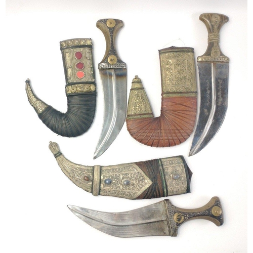 48 - Three vintage Yemeni jambiya daggers with leather sheaths decorated with Middle Eastern silver and s... 