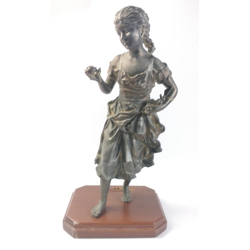 651 - A spelter figure of a young girl with fruit, standing an impressive 47cm tall approx and in generall... 