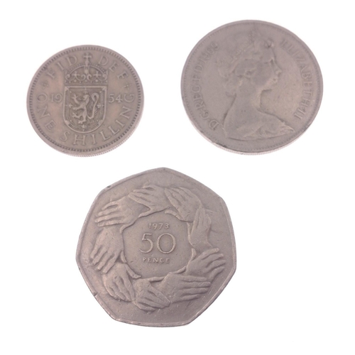 111 - A small bag of coins to include a 1973 50pence piece, a 10pence piece 1969 and lastly a one shilling... 