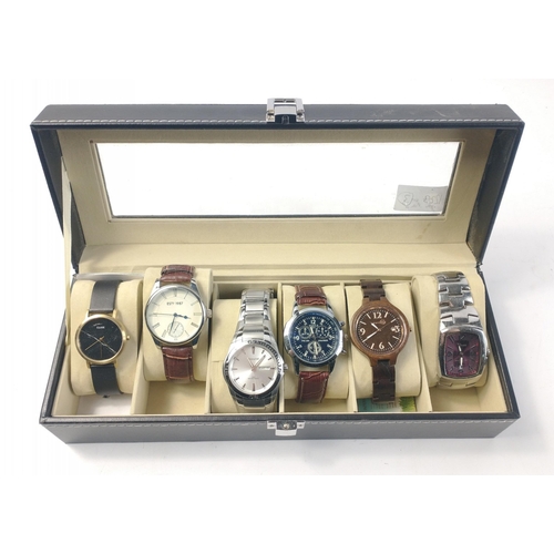 143 - A glass fronted watch display case with a variety of six gents watches#30