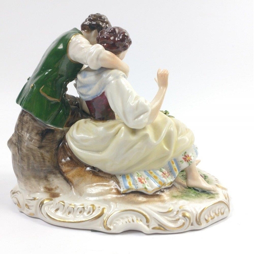 281 - An East German figurine of a young man and girl playing the flute, made mid 20th century by Rudolf K... 