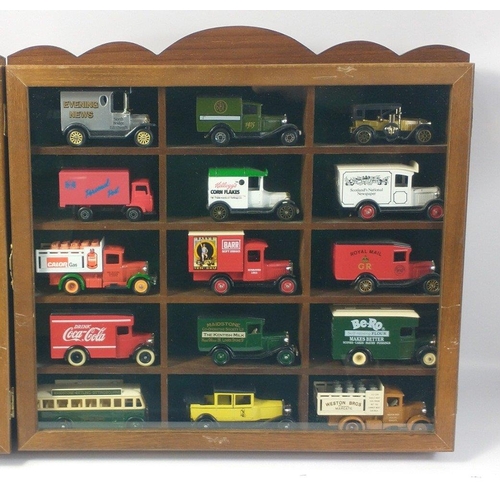 339 - Two small wall mounted display cases each with 15 toy trucks by various makers including LLEDO , DAY... 