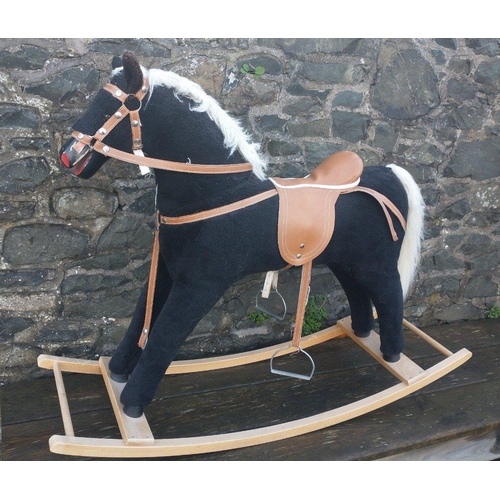 345 - Mamas & Papas Rocking horse with black wool coat, white mane and saddle. Floor to saddle is appr... 