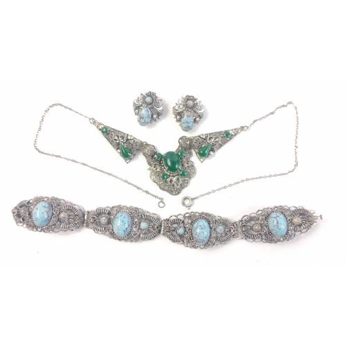 50 - A striking white metal filigree necklace with green stones approx 42cm long plus a white metal brace... 