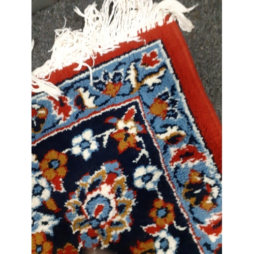 550 - Large vintage Persian rug red base with blue surround and a brown central medallion and intricate fl... 