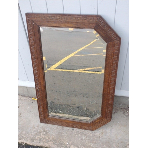 614 - VINTAGE! A six-sided wall mirror with wooden Greek key detail measuring 79x52cm approx#221