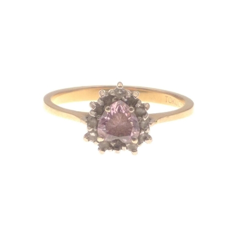 1 - A 10k stamped dress ring with a centred pink stone - weight gross 2.23g approx - ring size M/N#1