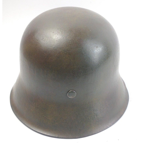 137 - WWII M40 German military helmet with later chin strap and applied SS decal.  There is a stamp '1937'... 