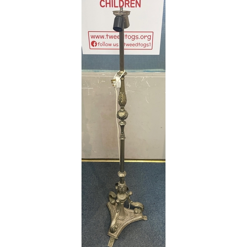 364 - A white metal standard lamp 145cm high with a three-footed base and elaborate stem leading to 2 ligh... 