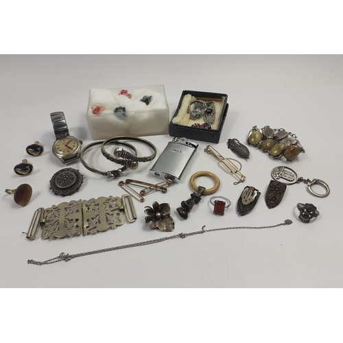 39 - A mixed bag of silver plate and white metal jewellery to include a nurse's buckle, a pair of collar ... 