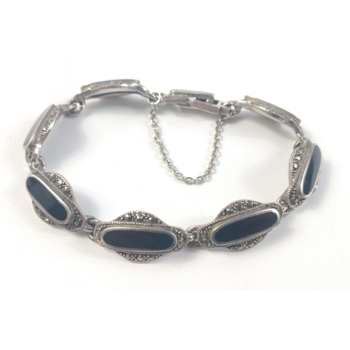 42 - A black-jet and marcasite inspired white metal bracelet with safety chain, and comes within a nice p... 