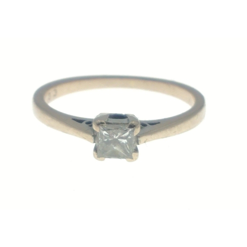 5 - An 18ct stamped white gold diamond engagement ring with a rectangular-cut clear diamond (dimension 4... 