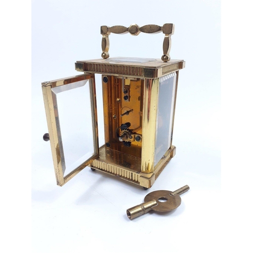 70 - Substantial solid ST JAMES LONDON brass carriage clock with key. Standing 12cm high approx this is a... 