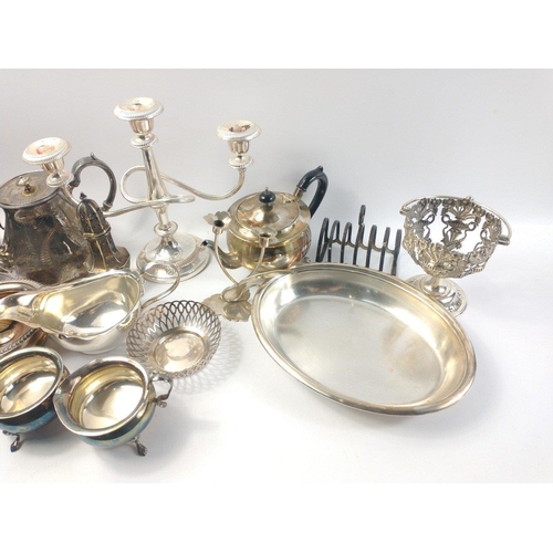 86 - A box of silver plate to include a WALKER & HALL vegetable dish (28cm), a toast rack, candelabra... 