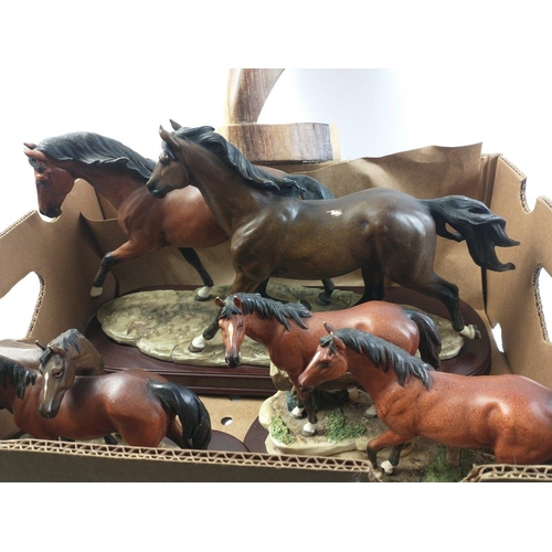 109 - A box containing three LEONARDO COLLECTION equestrian models and a carved wooden horses head from Ba... 