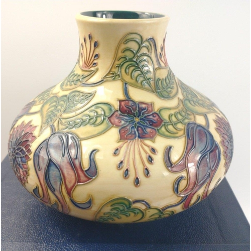 127 - A squat MOORCROFT vase in its original box stands approx 17cm high, label to base reads 'Seconds £42... 