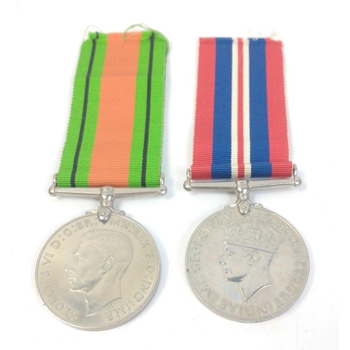 162 - A pair of WWII war medals to include A 19-45 War Medal and a Defence medal both with original ribbon... 