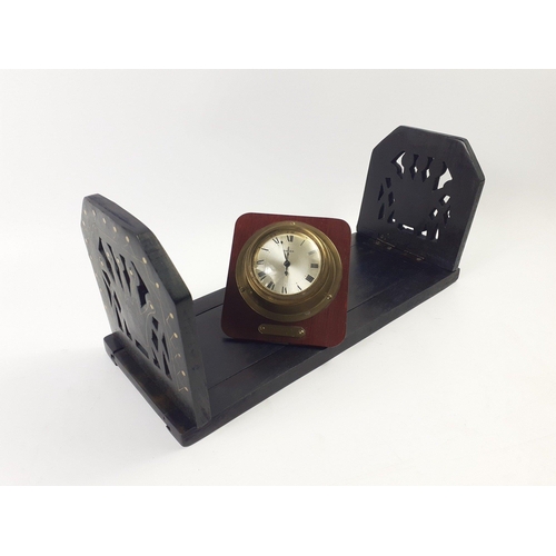 365 - A black ebony book slide 32cm long and a SWIZA nautical clock (needs attention) 10x12cm approx#382... 