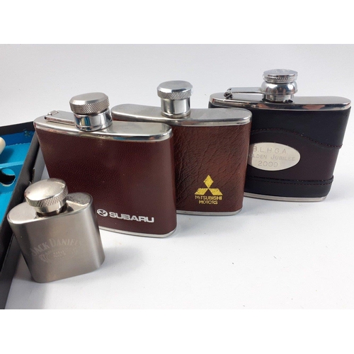 96 - Motoring memorabilia to include 4 oz hip flasks with leather covers and logos for Subaru, Mitsubishi... 