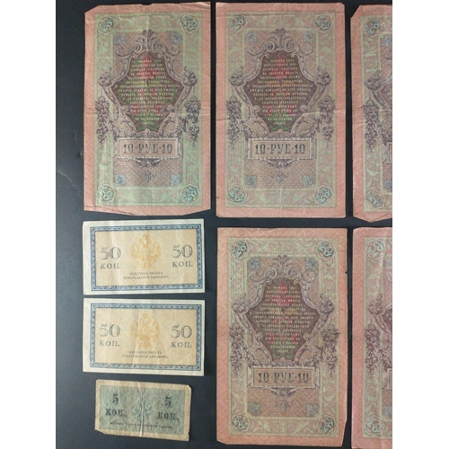 175 - A quantity of 10 Earlier RUSSIAN banknotes with wear.  Seven 1909  Roubles notes and three small KOP... 