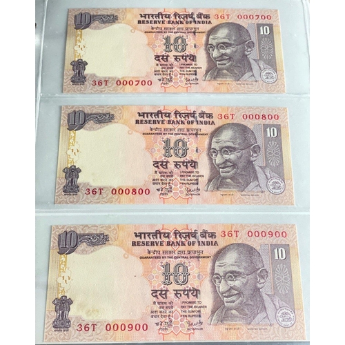 176 - A Numis banknote album containing a substantial collection of RESERVE BANK OF INDIA Ghandi notes in ... 