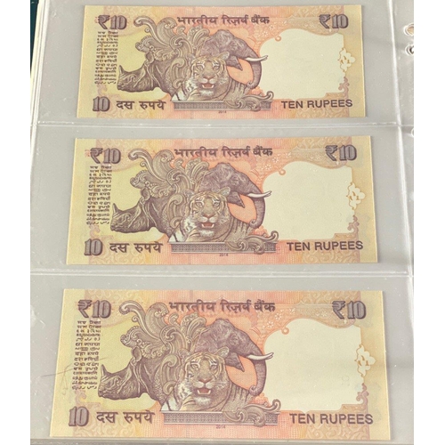 176 - A Numis banknote album containing a substantial collection of RESERVE BANK OF INDIA Ghandi notes in ... 