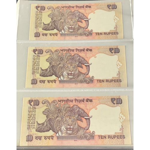 176 - A Numis banknote album containing a substantial collection of RESERVE BANK OF INDIA Ghandi notes in ... 