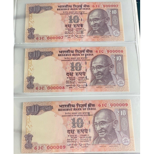 176 - A Numis banknote album containing a substantial collection of RESERVE BANK OF INDIA Ghandi notes in ... 